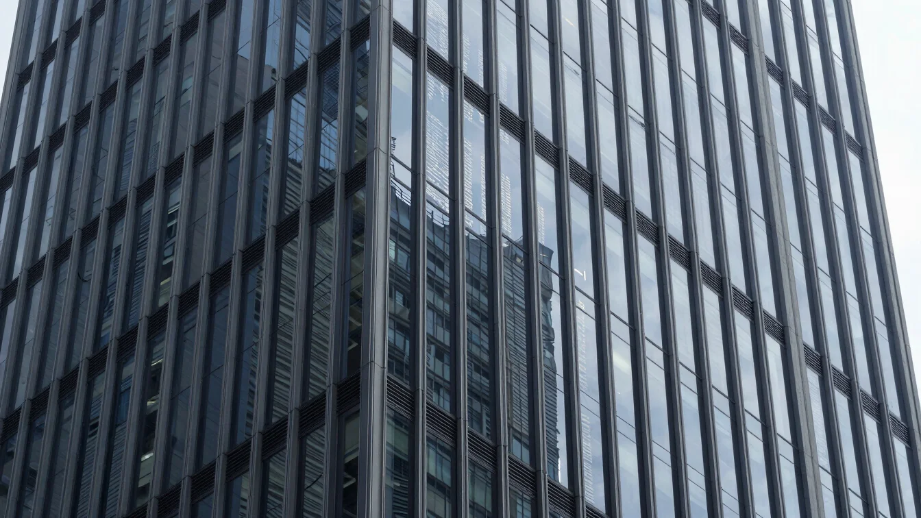 Architectural precision of a skyscraper facade reflecting financi